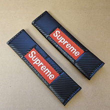 Load image into Gallery viewer, Brand New Universal 2PCS SUPREME Carbon Fiber Car Seat Belt Covers Shoulder Pad Cushion